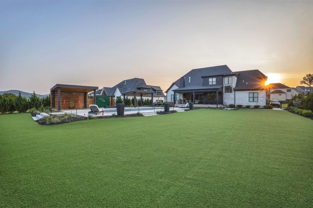 Custom backyard landscape design with turf by Denali in Nashville, TN