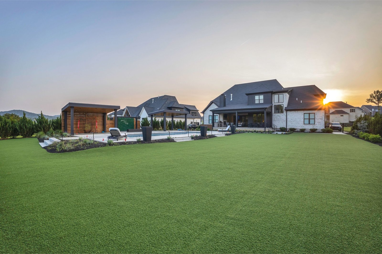Custom backyard landscape design with turf by Denali in Nashville, TN