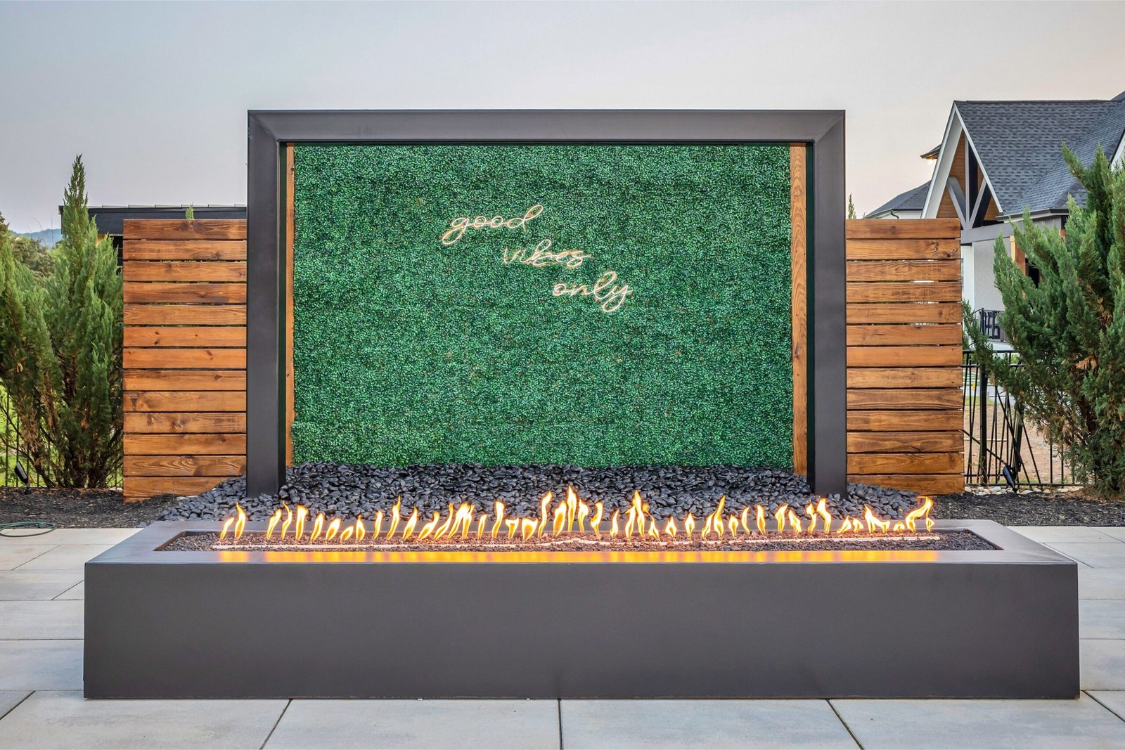 Backyard outdoor structures featuring fire feature, waterfall, and lighting by Denali in Nashville, TN