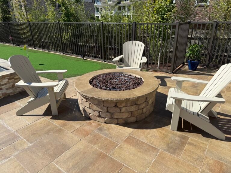 Custom firepit in Nashville backyard by Denali Pools & Outdoors with luxury outdoor living